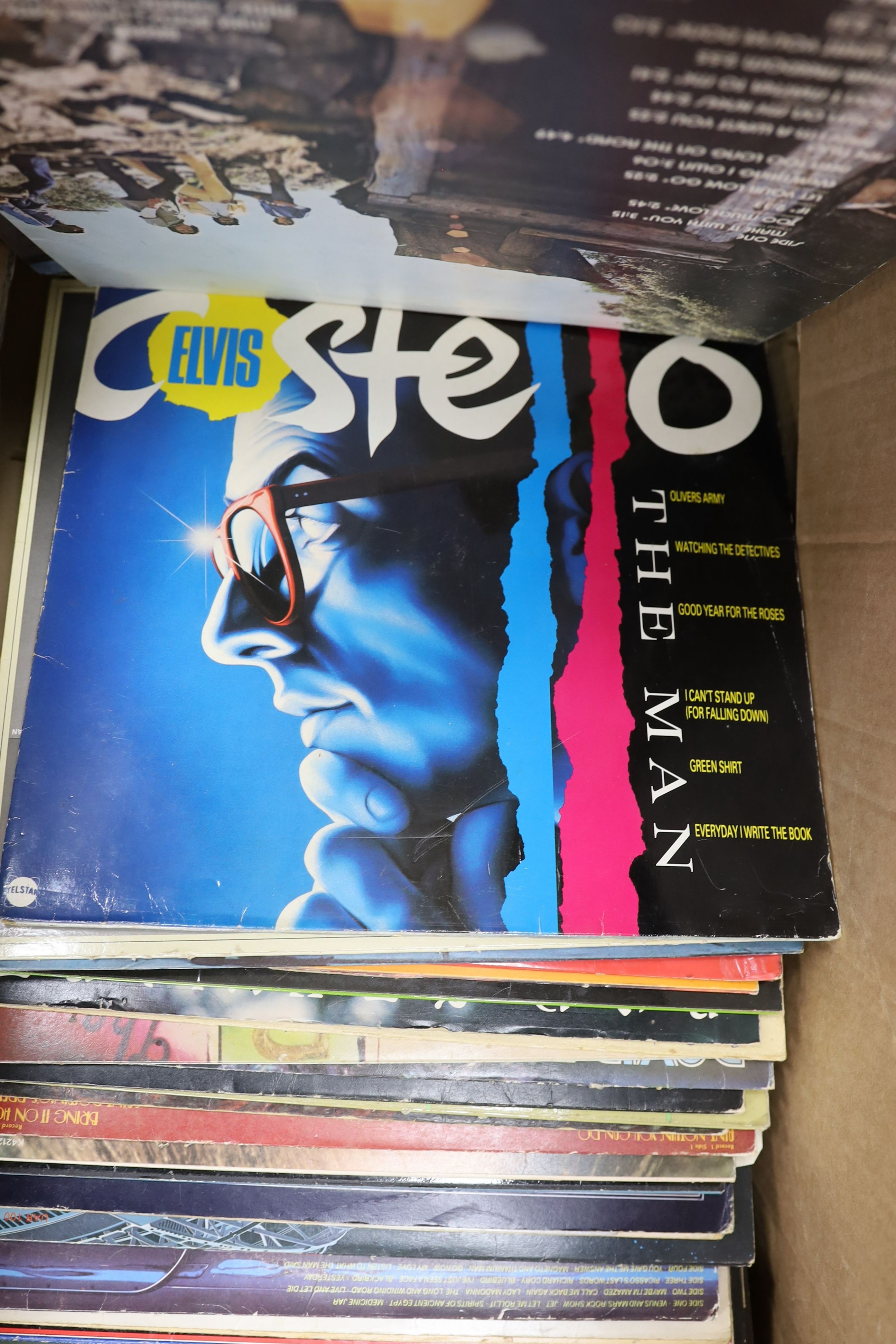 A collection of approximately 87 vinyl LPs to include The Beatles, David Bowie, Traffic, 10CC, Carly Simon etc